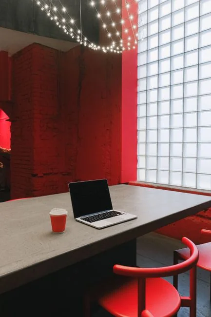 A focused designer works on a user-centric project in a modern office environment.